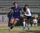 Lemoore's Jessica Padilla moves the ball against Sunnyside High Tuesday night in Lemoore's Tiger Stadium. The Tigers won 1-0.